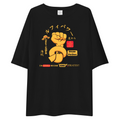 A black oversized short-sleeve t-shirt with a colorful graphic print on the front. The graphic features a yellow fist punching a sausage, Japanese text, a small red and yellow sign, and the phrase 'I'M GOING TO COME BACK AS A KING PIRATES!!'.