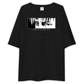 A black short-sleeve t-shirt with a wide, horizontal black-and-white anime graphic on the chest, featuring the Japanese text '〺おじさんしそす' below the illustration. The shirt is displayed flat against a solid white background.