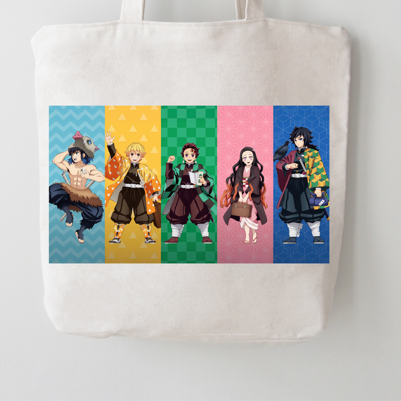 A white canvas tote bag featuring a colorful graphic print of five anime characters in vertical panels on a light gray background.